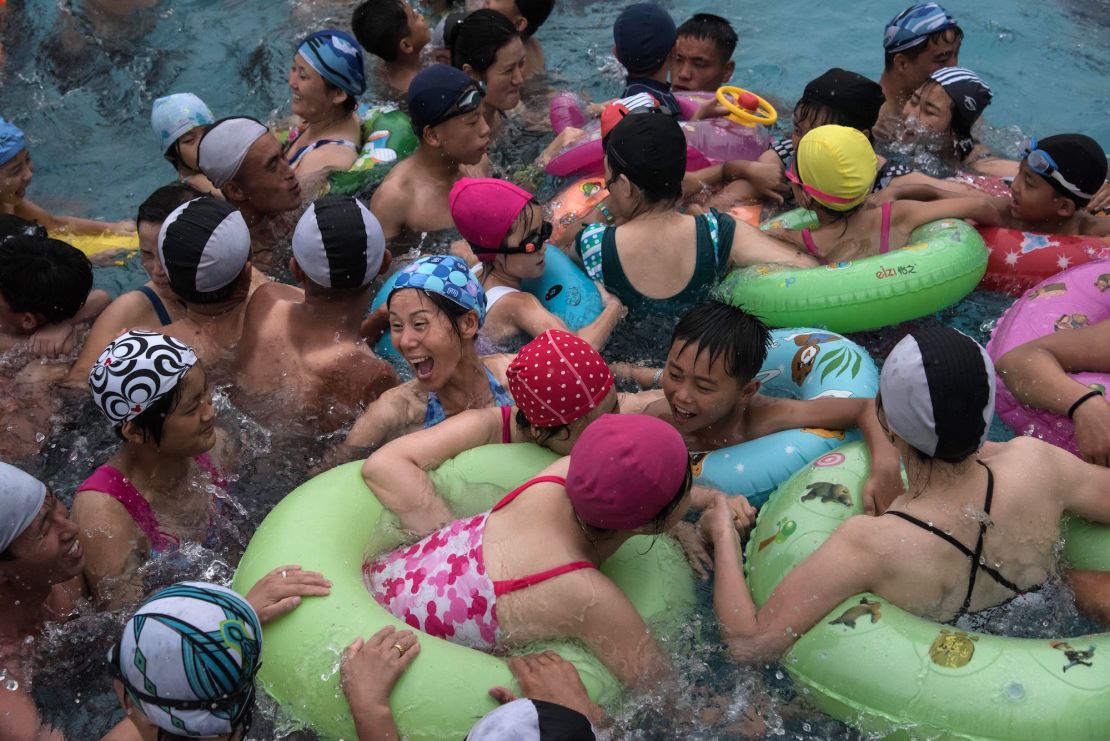 Swimmers gather in a Pyongyang leisure complex wave pool. 