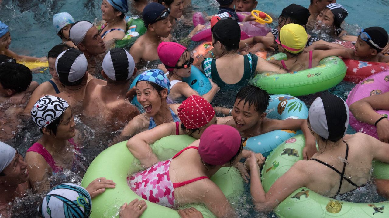 Swimmers gather in a Pyongyang leisure complex wave pool. 