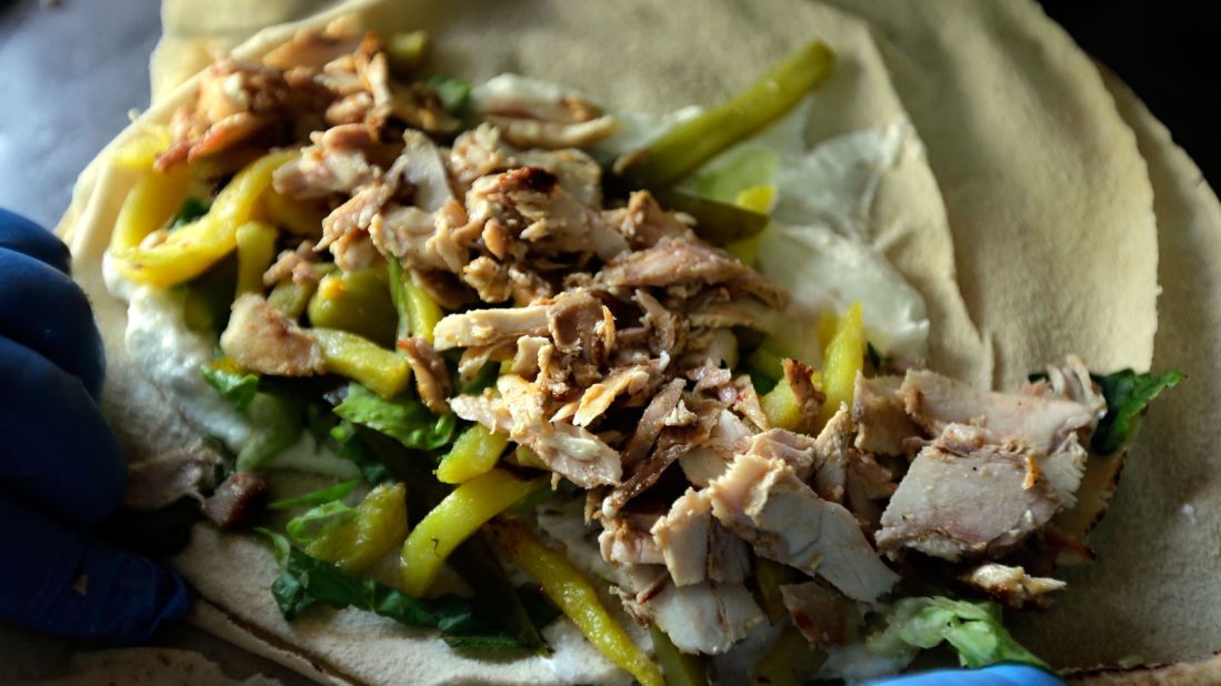 <strong>Shawarma:</strong> This wrap of tender shreds of skewered chicken, garlic puree and salad wrapped in pita have become a global post-session favorite.