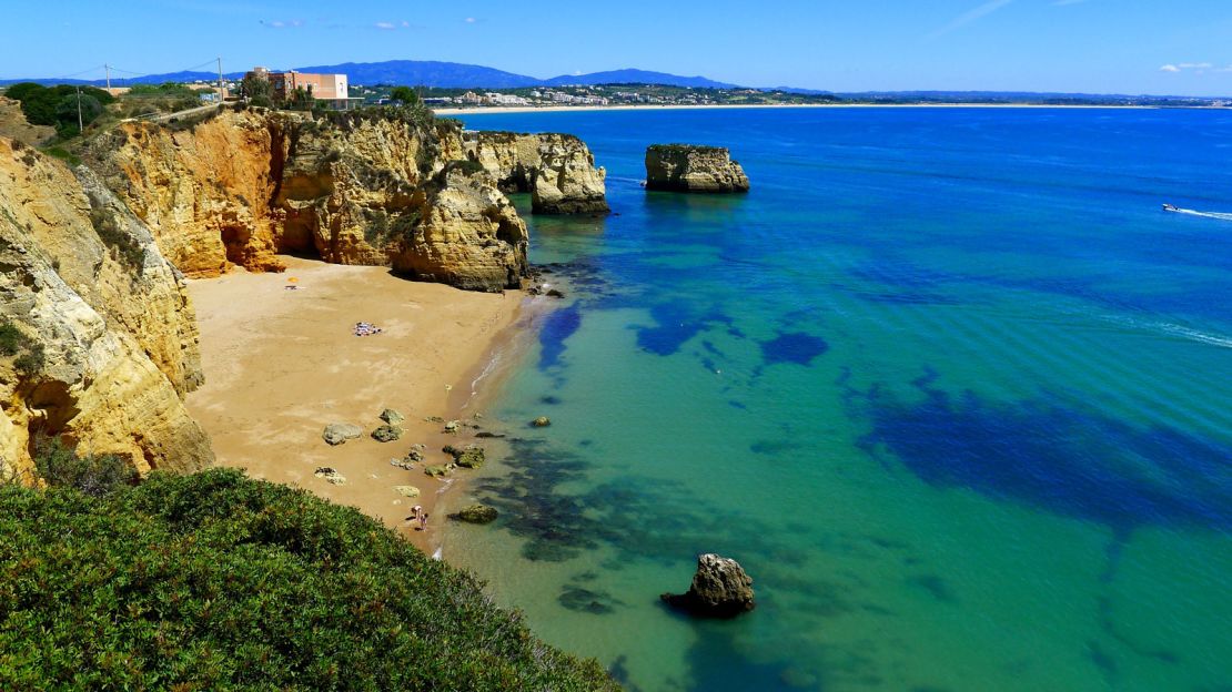 Praia do Pinhao is one of dozens of thin ribbons of golden sand at the foot of sheer cliffs near Lagos.