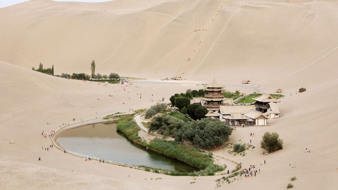 <strong>Echoing Sand Mountain and Crescent Lake, Dunhuang, Gansu: </strong>Echoing Sand Mountain is a series of dunes surrounding Crescent Lake. Named for its distinctive shape and aural characteristics, its echoes can be heard as the wind blows over the dunes.