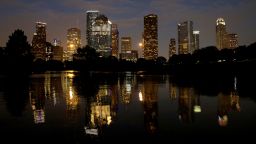 Downtown Houston is reflected in the flooded Buffalo Bayou on Wednesday, August 30.