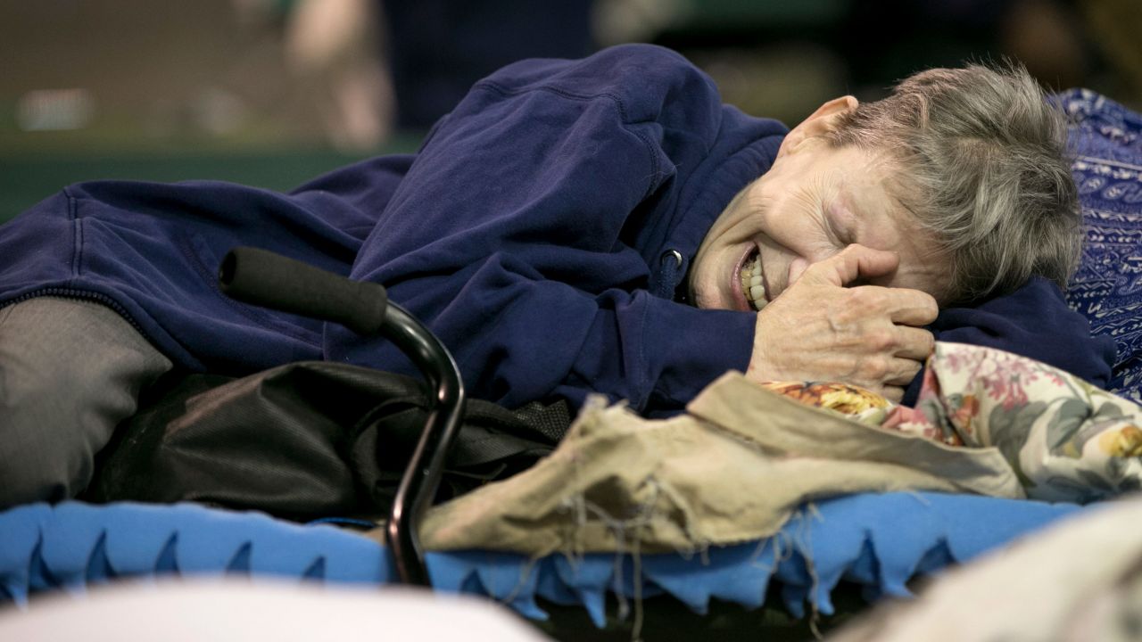 Janice Forse cries at a shelter Wednesday in Beaumont after her home was flooded.