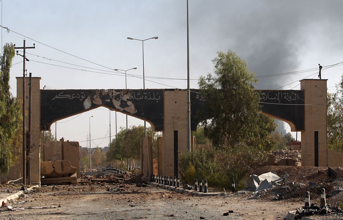 An image taken Wednesday shows a gate at the entrance of Tal Afar covered in writing from ISIS.