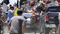 People fly into the air as a vehicle drives into a group of protesters demonstrating against a white nationalist rally in Charlottesville, Va., Saturday, Aug. 12, 2017. The nationalists were holding the rally to protest plans by the city of Charlottesville to remove a statue of Confederate Gen. Robert E. Lee. There were several hundred protesters marching in a long line when the car drove into a group of them. (Ryan M. Kelly/The Daily Progress via AP)