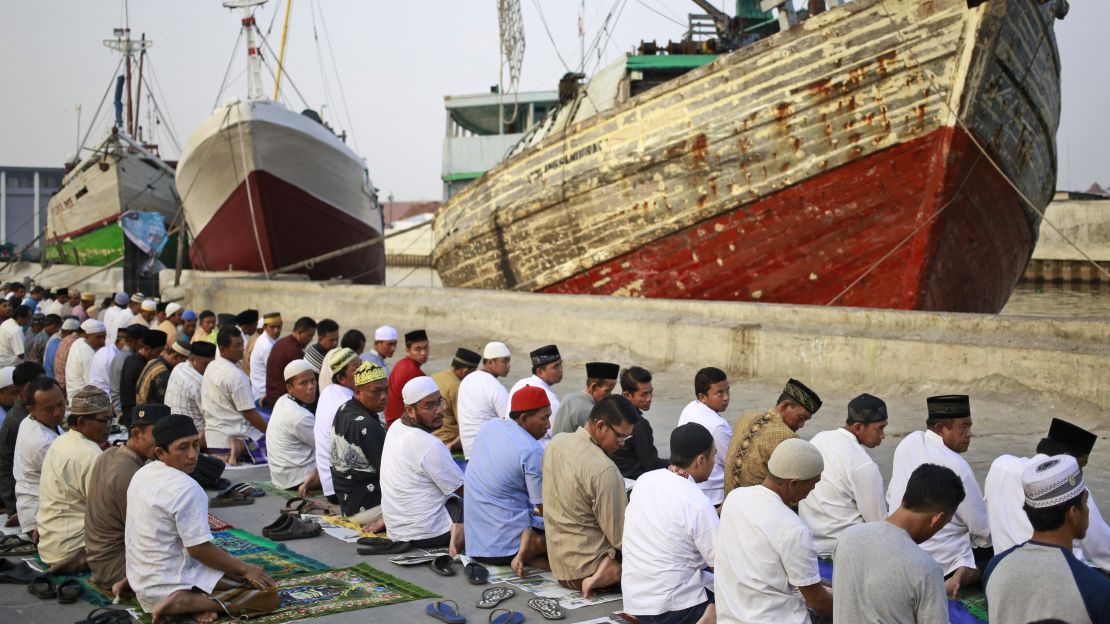 Muslim men attend a morning prayer marking Eid al-Adha at Sunda Kelapa port in Jakarta, Indonesia on Friday. 