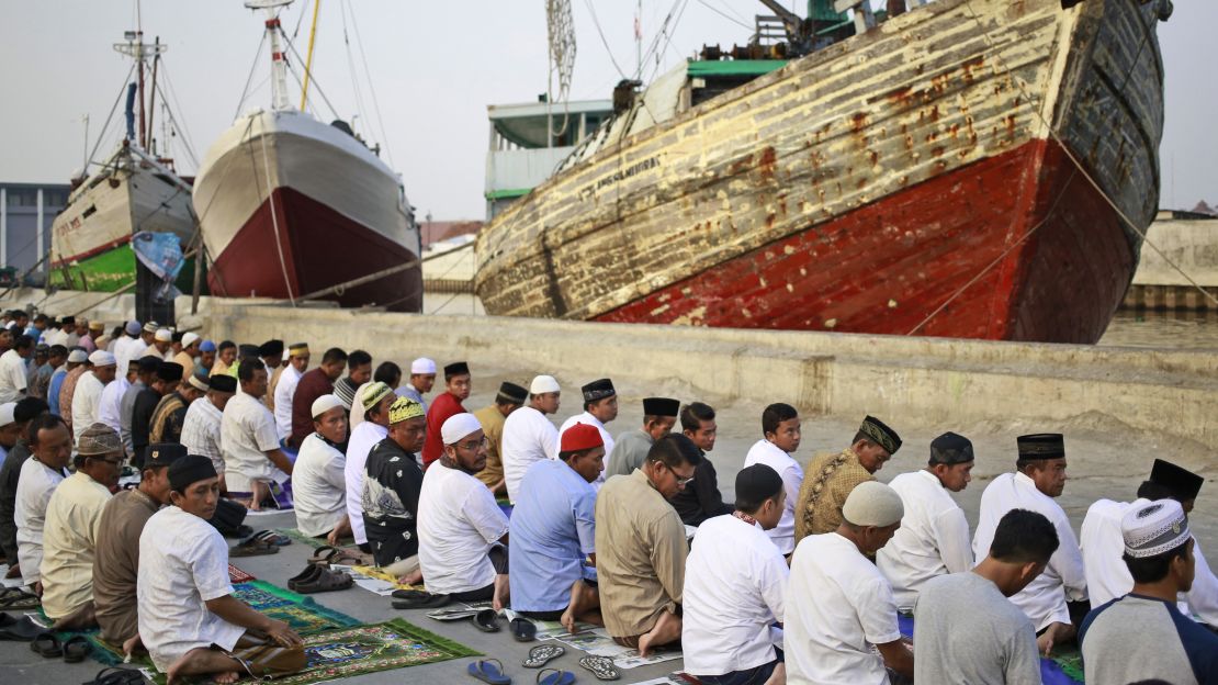 Muslim men attend a morning prayer marking Eid al-Adha at Sunda Kelapa port in Jakarta, Indonesia on Friday.