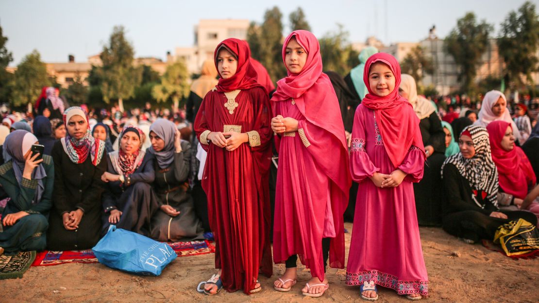 Muslims gather to perform the Eid al-Adha prayer at Es-Saraya Square in Gaza City, Gaza.