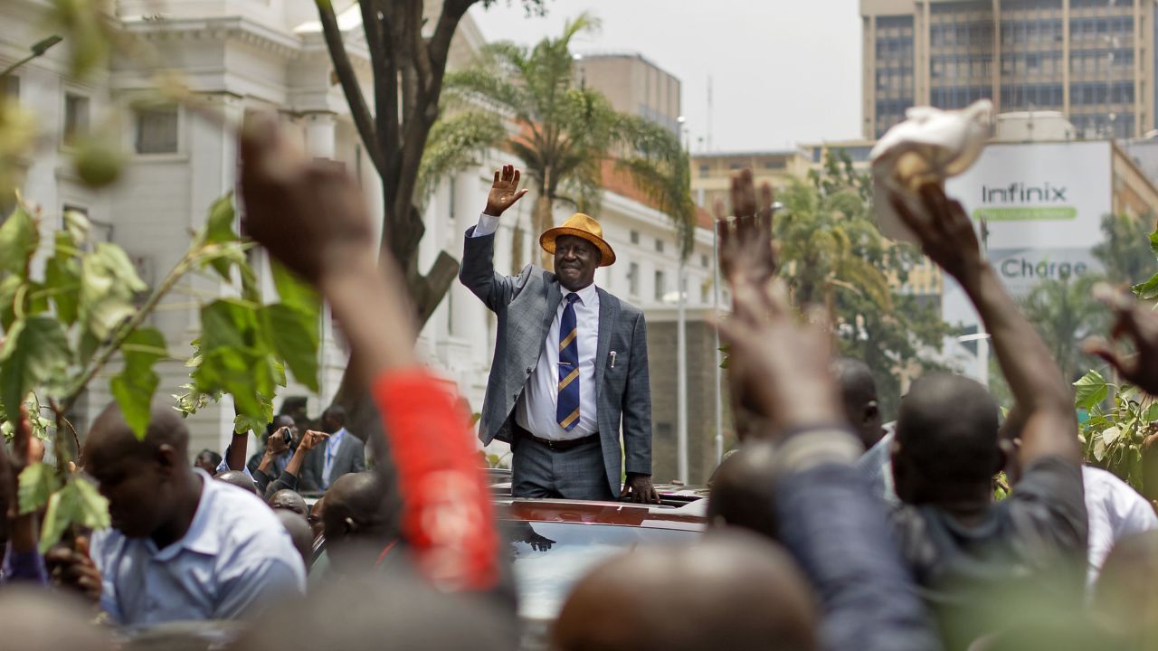 Odinga, the opposition leader, waves to supporters Friday as he leaves the Supreme Court  in Nairobi.