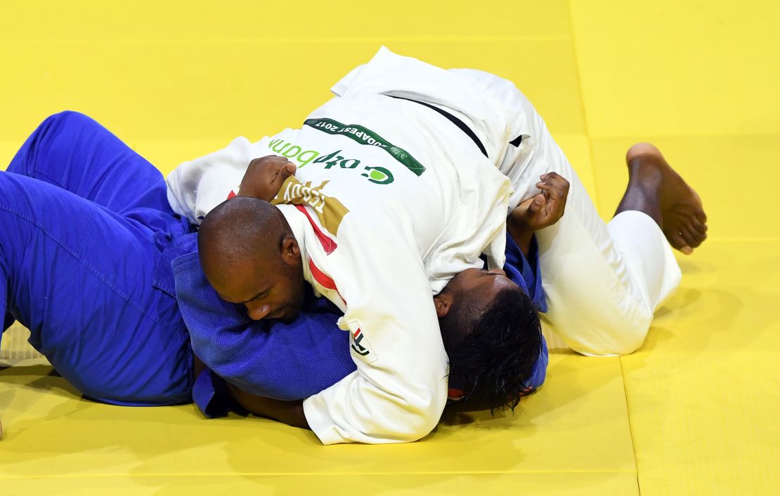Teddy Riner pins Ecuador's Freddy Figueroa for 20 seconds to score ippon in their third-round match.