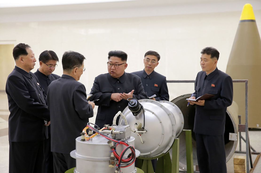 This undated picture released by North Korea's official Korean Central News Agency (KCNA) on September 3, 2017 shows North Korean leader Kim Jong Un looking at a metal casing at an undisclosed location. 