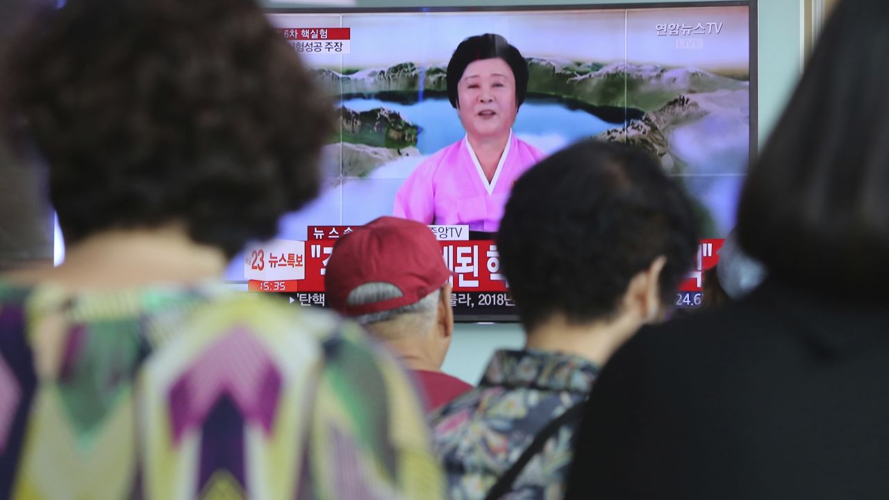 People watch a TV news program at the Seoul Railway Station in Seoul, Sunday, September 3, 2017, showing North Korea's announcement that it conducted an underground hydrogen bomb test. 