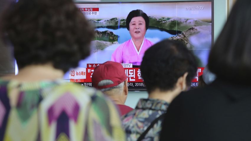 People watch a TV news program at the Seoul Railway Station in Seoul, Sunday, September 3, 2017, showing North Korea's announcement that it conducted an underground hydrogen bomb test.