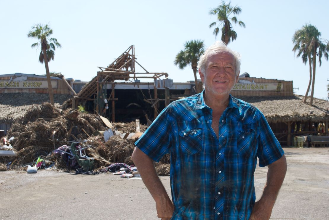 Ed Ziegler stands by his restaurant, now a ruin after Hurricane Harvey.