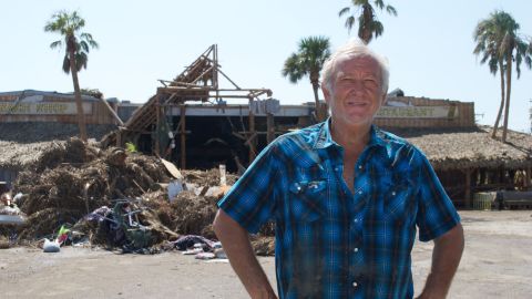 Ed Ziegler stands by his restaurant, now a ruin after Hurricane Harvey.