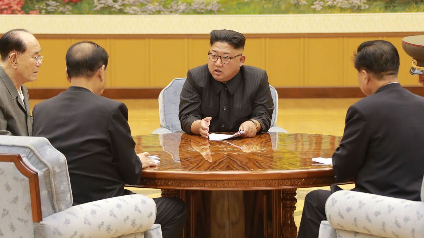 This picture was released by North Korea's official Korean Central News Agency (KCNA) on September 4, 2017 shows North Korean leader Kim Jong-Un (C) attending a meeting with a committee of the Workers' Party of Korea about the test of a hydrogen bomb, at an unknown location.
