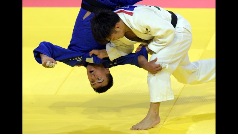 Japan's Hifumi Abe throws Ukraine's Georgii Zantaraia at the World Judo Championships on Tuesday, August 29. Abe defeated Zantaraia in the quarterfinals and went on to win gold in their weight class.
