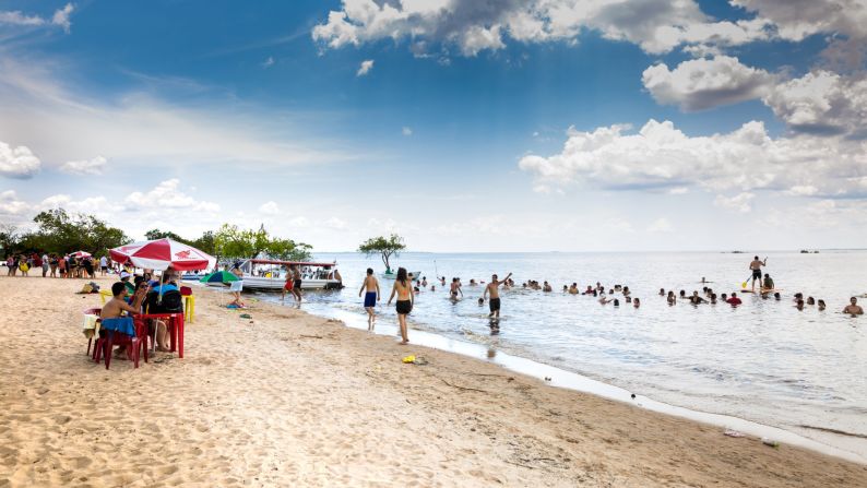 <strong>Surf and sand:</strong> Don't miss a chance to relax on the beach with a beer from local brewery Cervejeria Rio Negro.