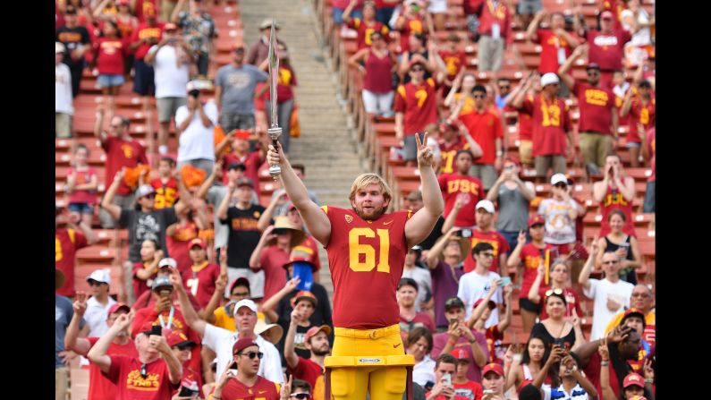 USC long snapper Jake Olson, <a href="index.php?page=&url=http%3A%2F%2Fwww.cnn.com%2F2016%2F01%2F06%2Fhealth%2Fturning-points-jake-olson%2Findex.html" target="_blank">who is blind,</a> leads the school's marching band after the football team defeated Western Michigan on Saturday, September 2. Olson <a href="index.php?page=&url=http%3A%2F%2Fbleacherreport.com%2Farticles%2F2731160-blind-usc-long-snapper-jake-olson-takes-field-for-successful-extra-point-attempt" target="_blank" target="_blank">played in a game</a> for the first time in his career, snapping the ball for a successful extra point.