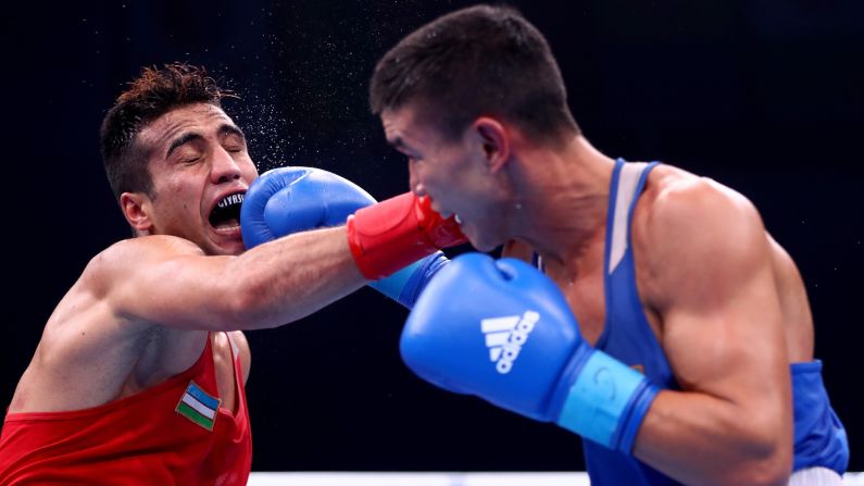 Shakhram Giyasov, a boxer from Uzbekistan, takes a punch from Kazakhstan's Ablaikhan Zhussupov during a welterweight bout in Hamburg, Germany, on Friday, September 1. Giyasov defeated Zhussupov in what was a semifinal match at the AIBA World Boxing Championships. Giyasov went on to win the gold medal. Zhussupov got the bronze.