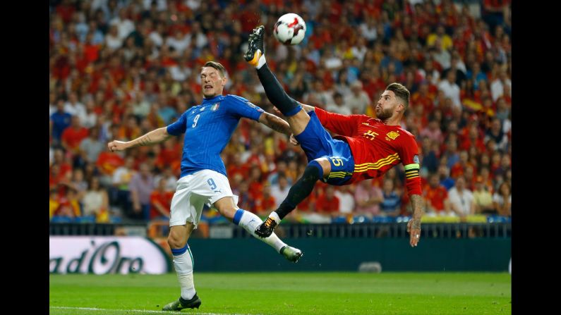 Spanish defender Sergio Ramos clears the ball near Italy's Andrea Belotti during a World Cup qualifier on Saturday, September 2. Spain won the match 3-0 in Madrid.