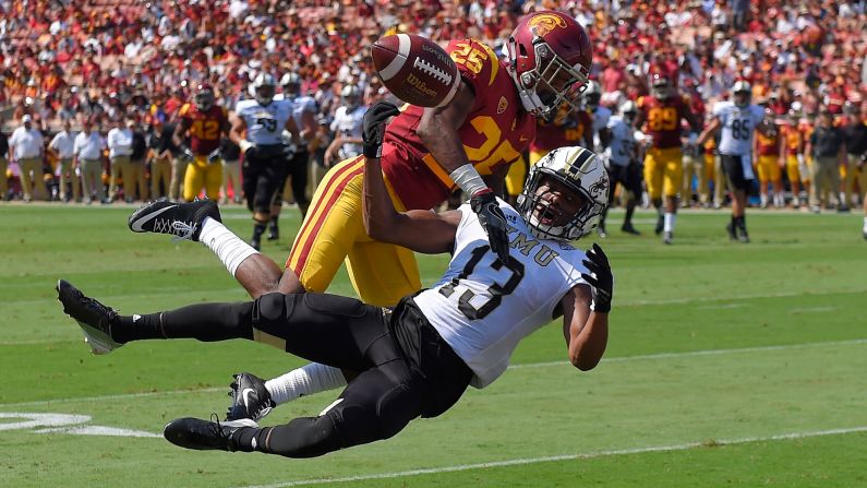 USC cornerback Jack Jones, top, defends Western Michigan wide receiver Keishawn Watson during a college football game in Los Angeles on Saturday, September 2.