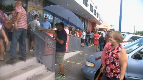 Crowds wait outside a store in Puerto Rico as Hurricane Irma nears.