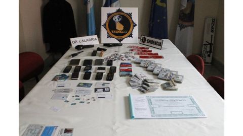 Italian mobster Rocco Morabito's arsenal of ID cards, credit cards and cell phones. The so-called "King of Cocaine" was arrested after evading authorities for more than 20 years.