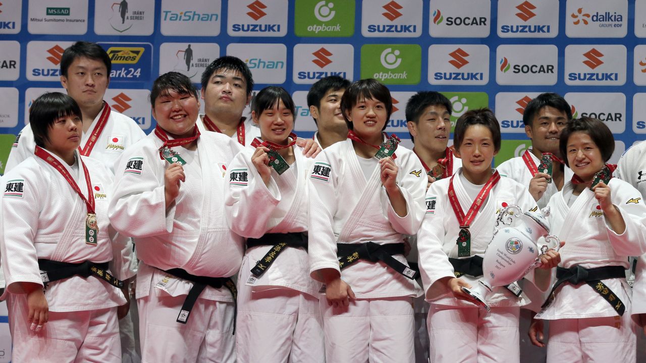 Japanese judoka celebrate winning Sunday's team event at the World Judo Championships