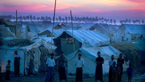 Rohingya refugees stand at a crowded camp in 2012 on the outskirts of Sittwe, Myanmar.