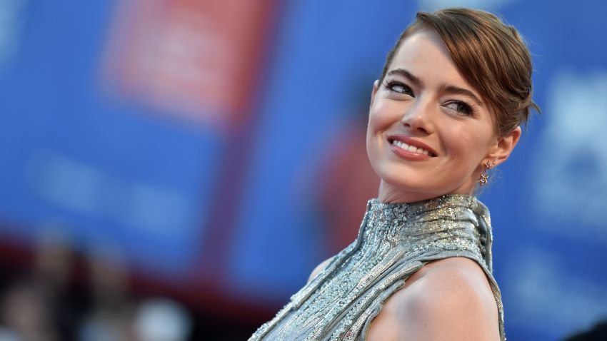 US actress Emma Stone poses on the red carpet as she arrives for the screening of the movie "La La Land" at the opening ceremony of the 73rd Venice Film Festival, on August 31, 2016 at Venice Lido. / AFP / TIZIANA FABI        (Photo credit should read TIZIANA FABI/AFP/Getty Images)