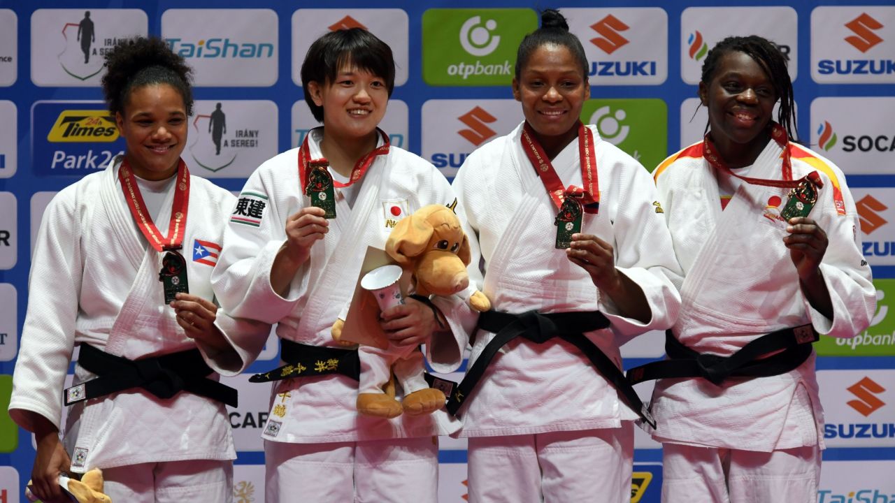 Women's middleweight judoka Maria Perez (L) celebrates winning Puerto Rico's first ever silver medal. Japan's Chizuru Arai, Colombia's Yuri Alvear and Spain's Maria Bernabeu join her on the podium.