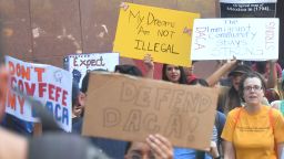 Young immigrants and supporters walk holding signs during a rally in support of Deferred Action for Childhood Arrivals (DACA) in Los Angeles, California on September 1, 2017.
A decision is expected in coming days on whether US President Trump will end the program by his predecessor, former President Obama, on DACA which has protected some 800,000 undocumented immigrants, also known as Dreamers, since 2012. / AFP PHOTO / FREDERIC J. BROWN        (Photo credit should read FREDERIC J. BROWN/AFP/Getty Images)