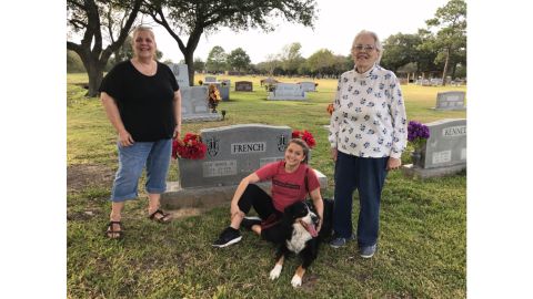 Frances French (right) pays a visit to her husband's gravesite.
