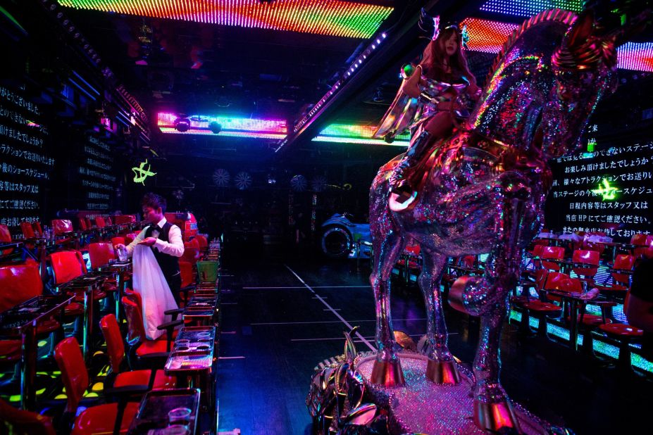 <strong>After the show: </strong>A man cleans up the stage after a show as a large robotic horse is moved back into position -- and the countdown to the next fantastical performance begins.