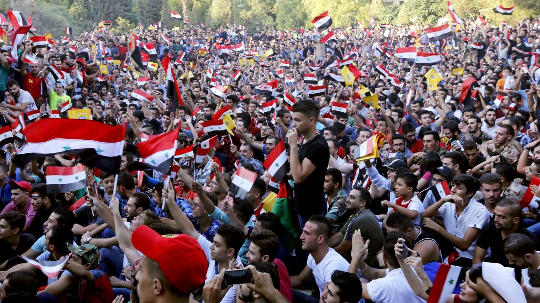 Syrian fans watch their team from Damascus on Tuesday. The nation has been ravaged by civil war.