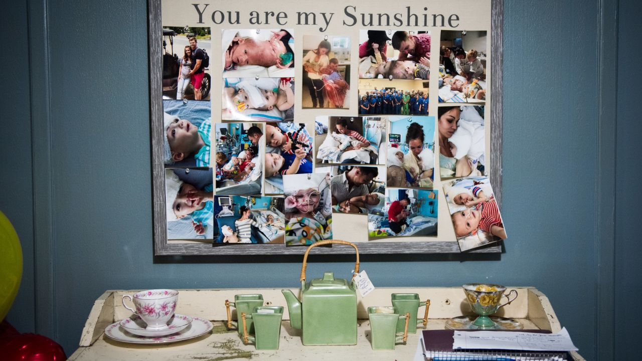 A collection of family photos hangs in the dining room of the McDonalds' home.
