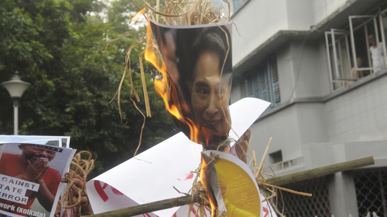 Protesters in Kolkata, India, burn Myanmar's Aung San Suu Kyi in effigy on Monday.
