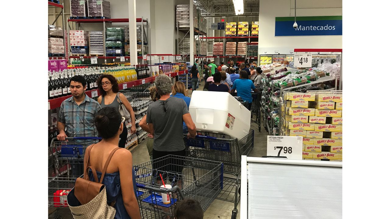 In San Juan, people stood on long lines Tuesday afternoon at a Sam's Club.