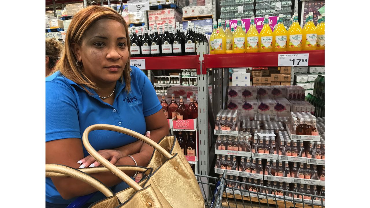 Joanna Martinez buys water at a Sam's Club in San Juan, Puerto Rico.