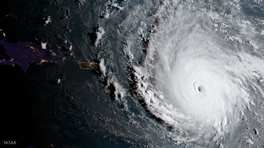 In this geocolor image captured by GOES-16  and released by the National Oceanic and Atmospheric Administration (NOAA), Hurricane Irma, a potentially catastrophic category 5 hurricane, moves westward, Tuesday morning, Sept. 5, 2017, in the Atlantic Ocean toward the Leeward Islands. This image was captured as daylight moves into the area, right, with nighttime features on the left side of the image. Hurricane Irma grew into a dangerous Category 5 storm, the most powerful seen in the Atlantic in over a decade, and roared toward islands in the northeast Caribbean Tuesday on a path that could eventually take it to the United States. (NOAA via AP)