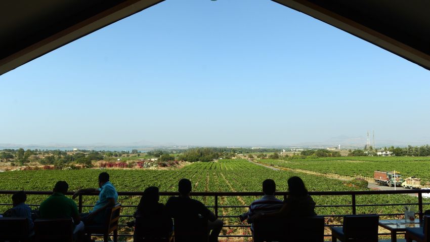 Indian visitors enjoy wine at the lounge bar at the Sula Vineyard in Nashik, around 103 miles from Mumbai. Boasting India's first vineyard resort, billed as an "antidote for stressed out city folk," Sula is luring crowds of urban middle-class tourists who are eager to learn more about wine.