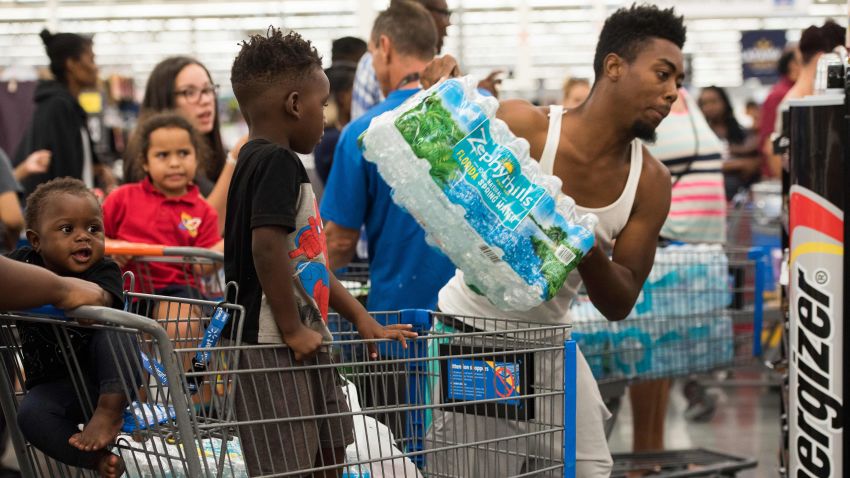 People stock up with water and other supplies at a Walmart in Fort Lauderdale, Florida, on Tuesday, September 5.