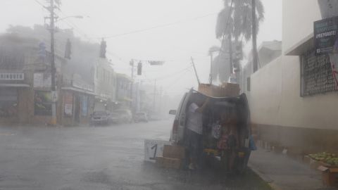 People prepare Wednesday for Irma's arrival in San Juan, Puerto Rico.