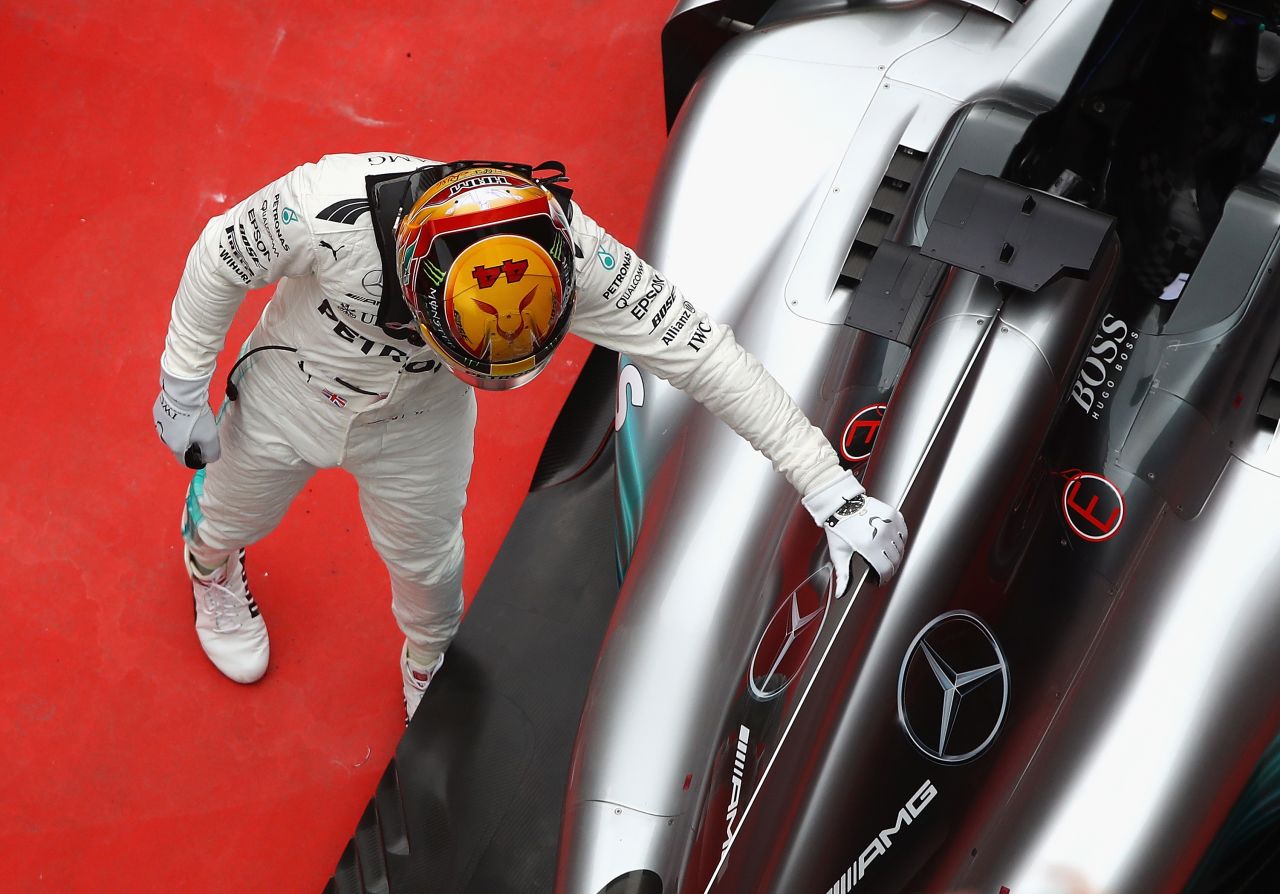 Hamilton pats his Mercedes car after it propelled him to victory at the Shanghai International Circuit. It was his fifth career win in China and saw the Briton draw level on points with Vettel who came home second. Red Bull's Max Verstappen was third. <br /><br /><strong>Drivers' title race after round 2</strong><br />Vettel 43 points<br />Hamilton 43 points<br />Bottas 23 points