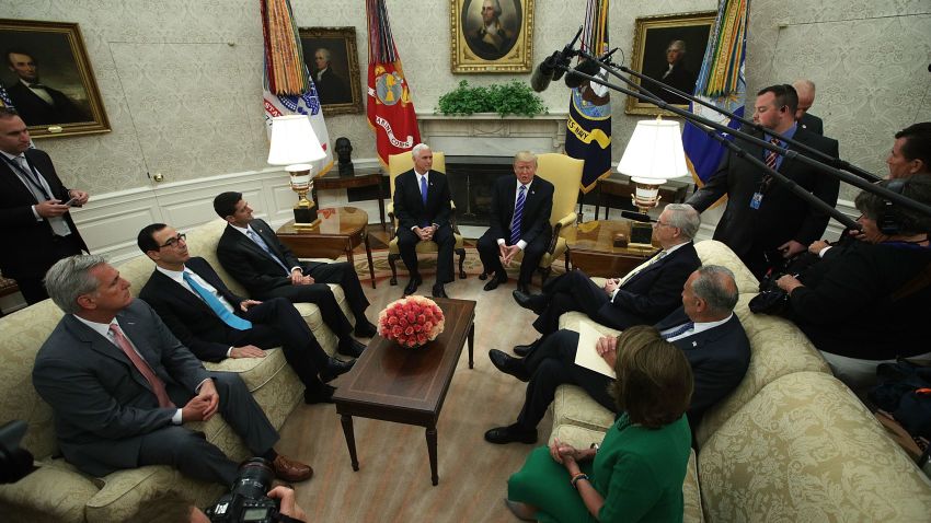 WASHINGTON, DC:  U.S. President Donald Trump (Top right) and Vice President Mike Pence (Top left) meet with: (clockwise from lower left) House Majority Leader Rep. Kevin McCarthy (R-CA), Treasury Secretary Steven Mnuchin, Speaker of the House Rep. Paul Ryan (R-WI), Senate Majority Leader Sen. Mitch McConnell (R-KY), Senate Minority Leader Sen. Chuck Schumer (D-NY) and House Minority Leader Rep. Nancy Pelosi (D-CA) in the Oval Office of the White House September 6, 2017 in Washington, DC. President Trump met with Congressional leaders to discuss bi-partisan issues.  (Alex Wong/Getty Images)