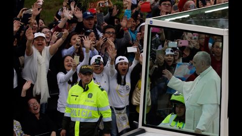 People welcome Francis to Bogota as he makes his way from the airport to the Nunciature on September 6.
