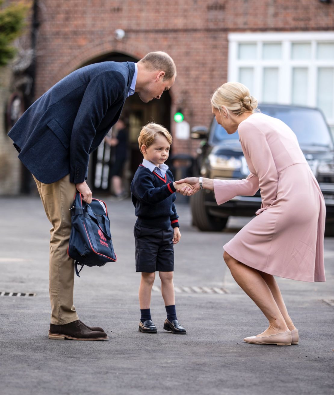 Prince George of Cambridge arrives for his first day of school with his father Prince William on September 7, 2017.