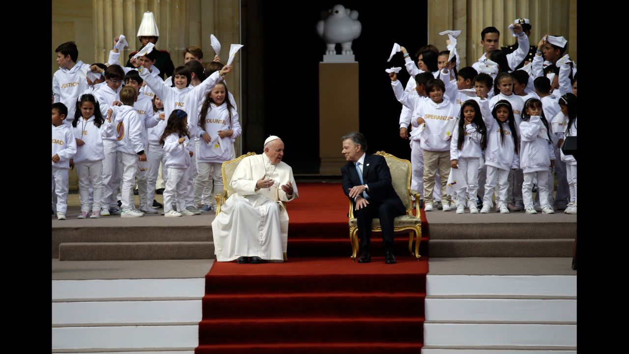 Francis confers with Colombian President Juan Manuel Santos before a ceremony Thursday, September 7, at the presidential palace in Bogota.