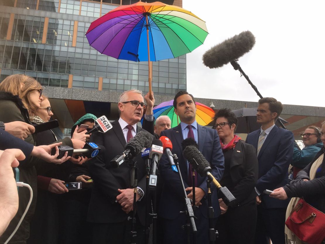 Australian independent political Andrew Wilkie (center left) speaks to media Thursday after High Court knocks down his challenge to same-sex marriage vote.